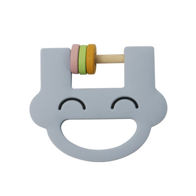 El traqueteo lindo Teether del silicón de los juguetes de los niños del silicón de la cara de la sonrisa con modifica el ODM del OEM para requisitos particulares del logotipo