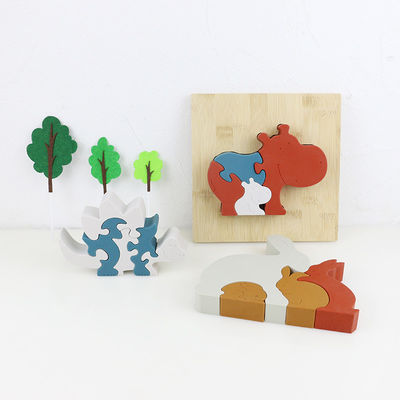 Modifique el rompecabezas del silicón para requisitos particulares, rompecabezas infantiles 3D con la base de bambú de madera