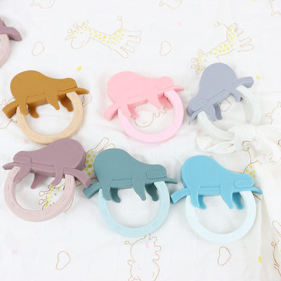 Forma de Teether Toy With Penguin Unicorn Raccoon del bebé del silicón de la historieta