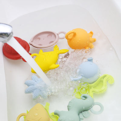 NUEVOS niños de los niños de la llegada que flotan los juguetes libres del agua del silicón de la dentición de la categoría alimenticia del bpa de los juguetes del silicón del baño