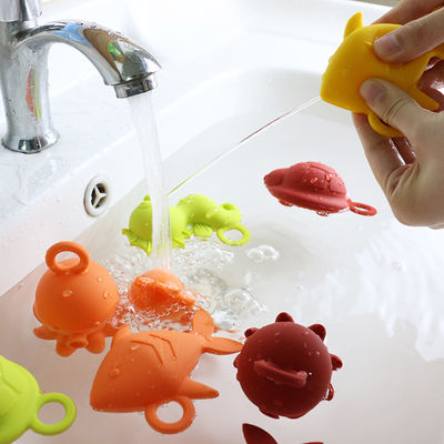 NUEVOS niños de los niños de la llegada que flotan los juguetes libres del agua del silicón de la dentición de la categoría alimenticia del bpa de los juguetes del silicón del baño