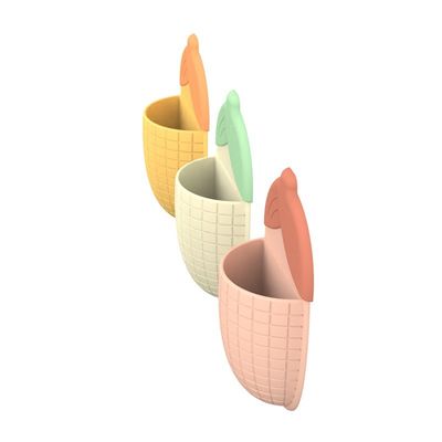 Cubierto de pasta de dientes con copa de succión en forma de maíz
